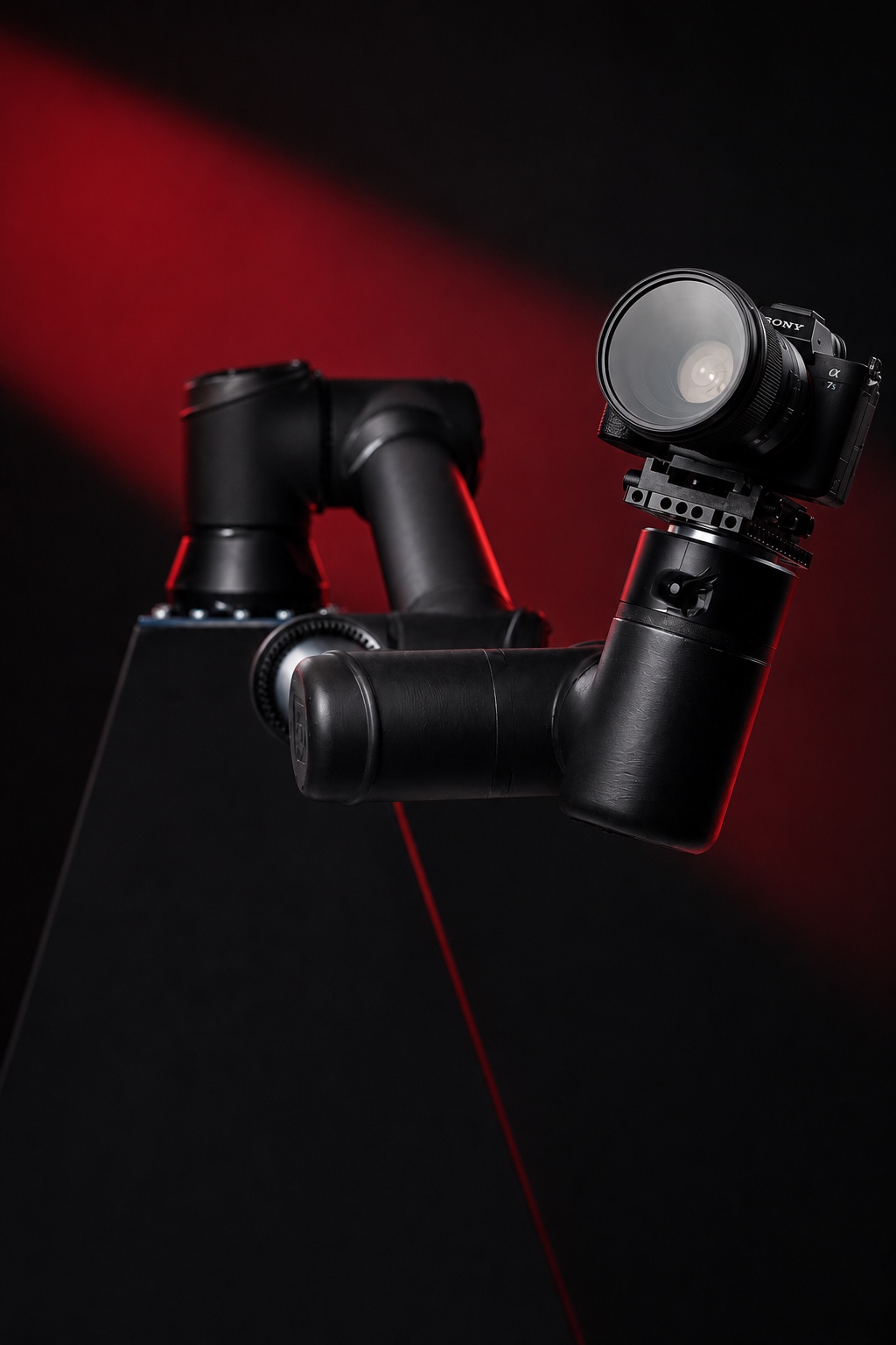 Close view of the Sony camera, lens, mounting plate and upper joints of Red Carpet Robot Jr.
