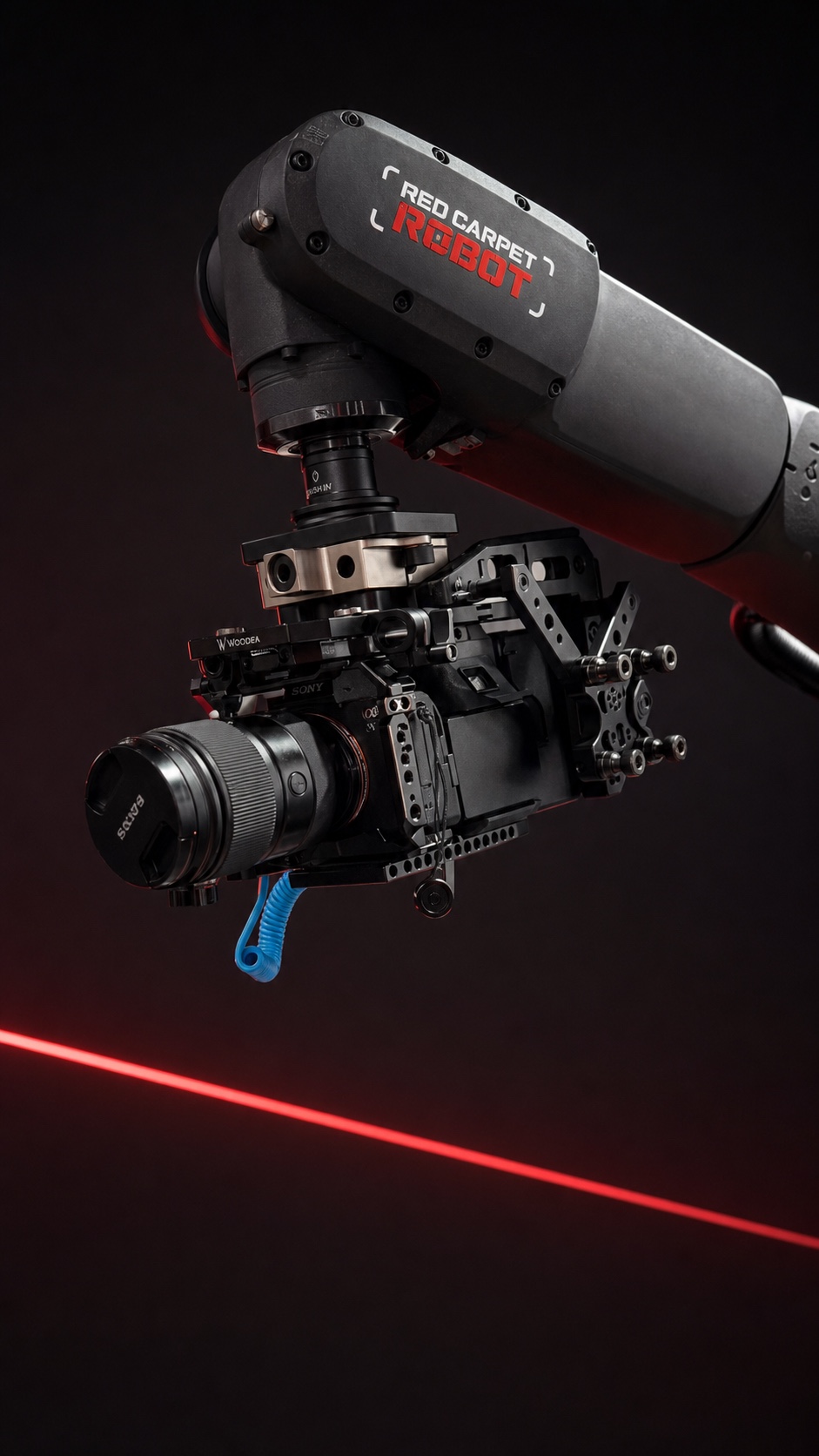 Close view of the Red Carpet Robot Max camera cage, lens, rigid mounting plate and branded KUKA robot arm