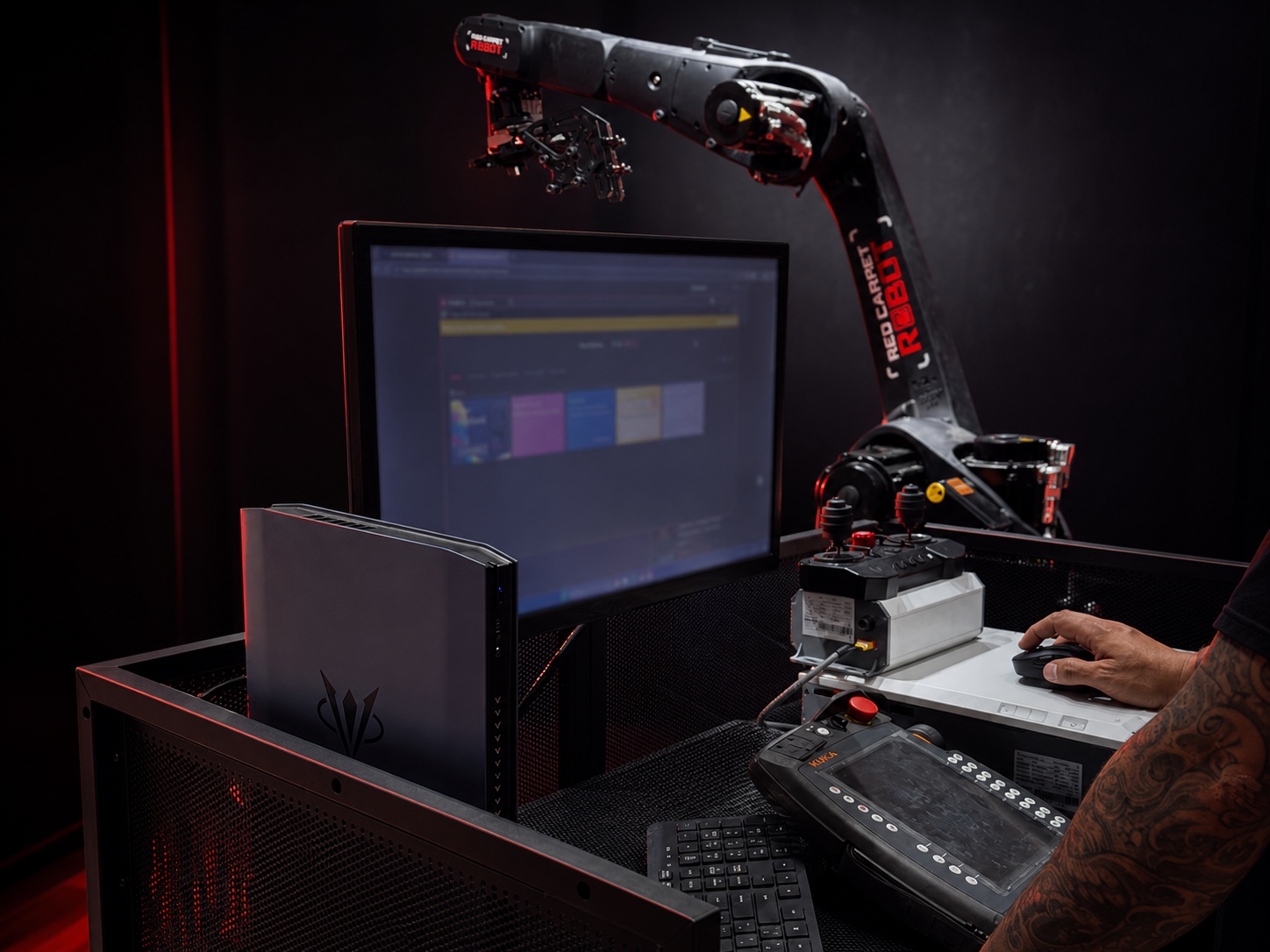 Red Carpet Robot Max dedicated operator console with KUKA SmartPad, monitor, computer, controls and human operator